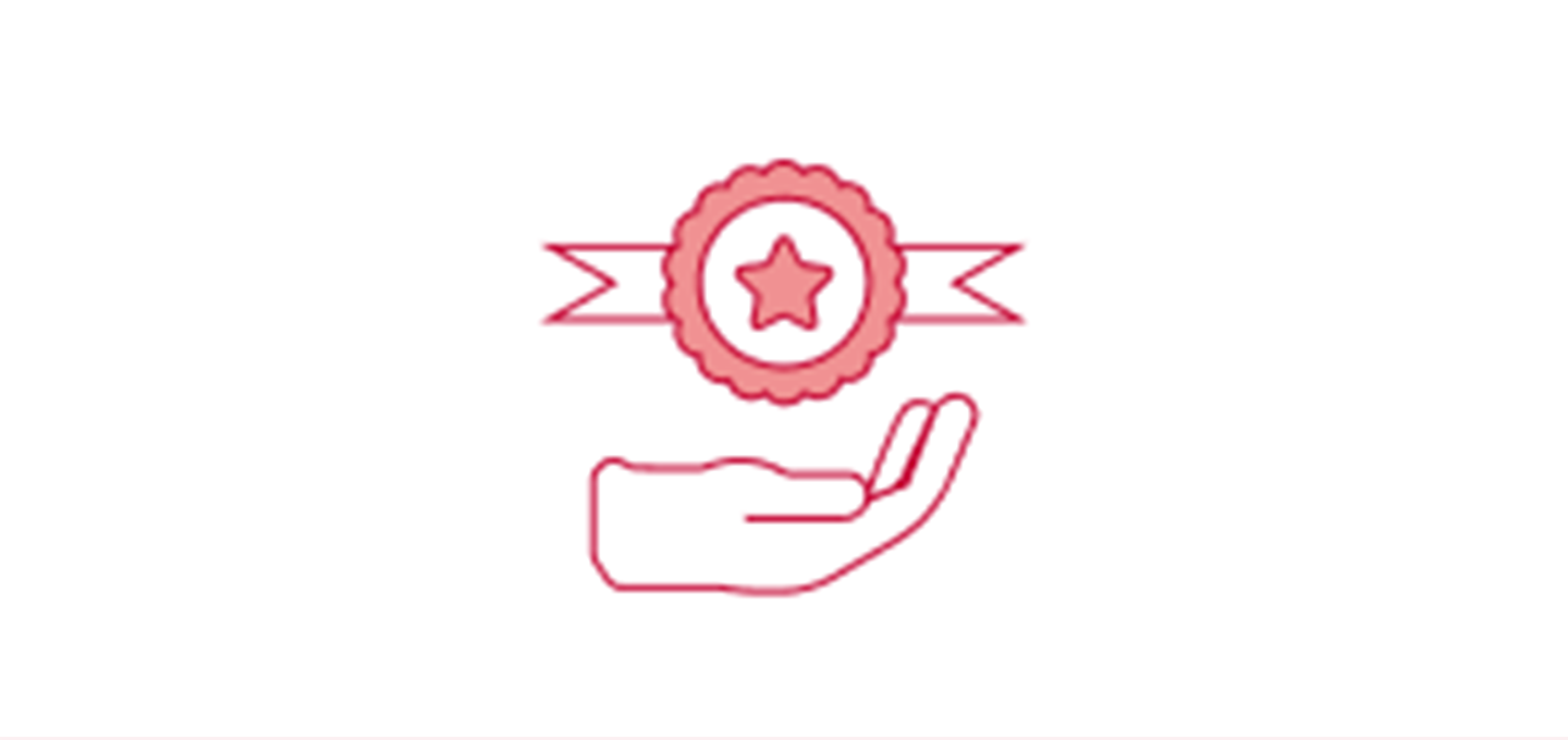 A ribbon with star on it and a hand below